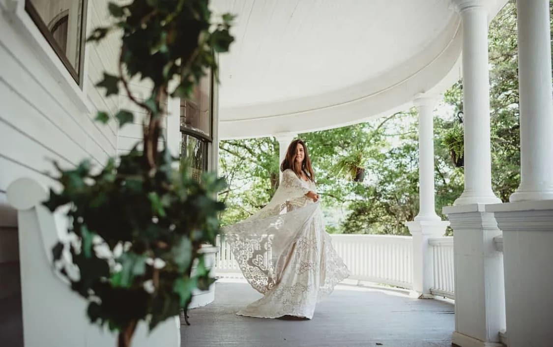 Bride on elegant porch at venue