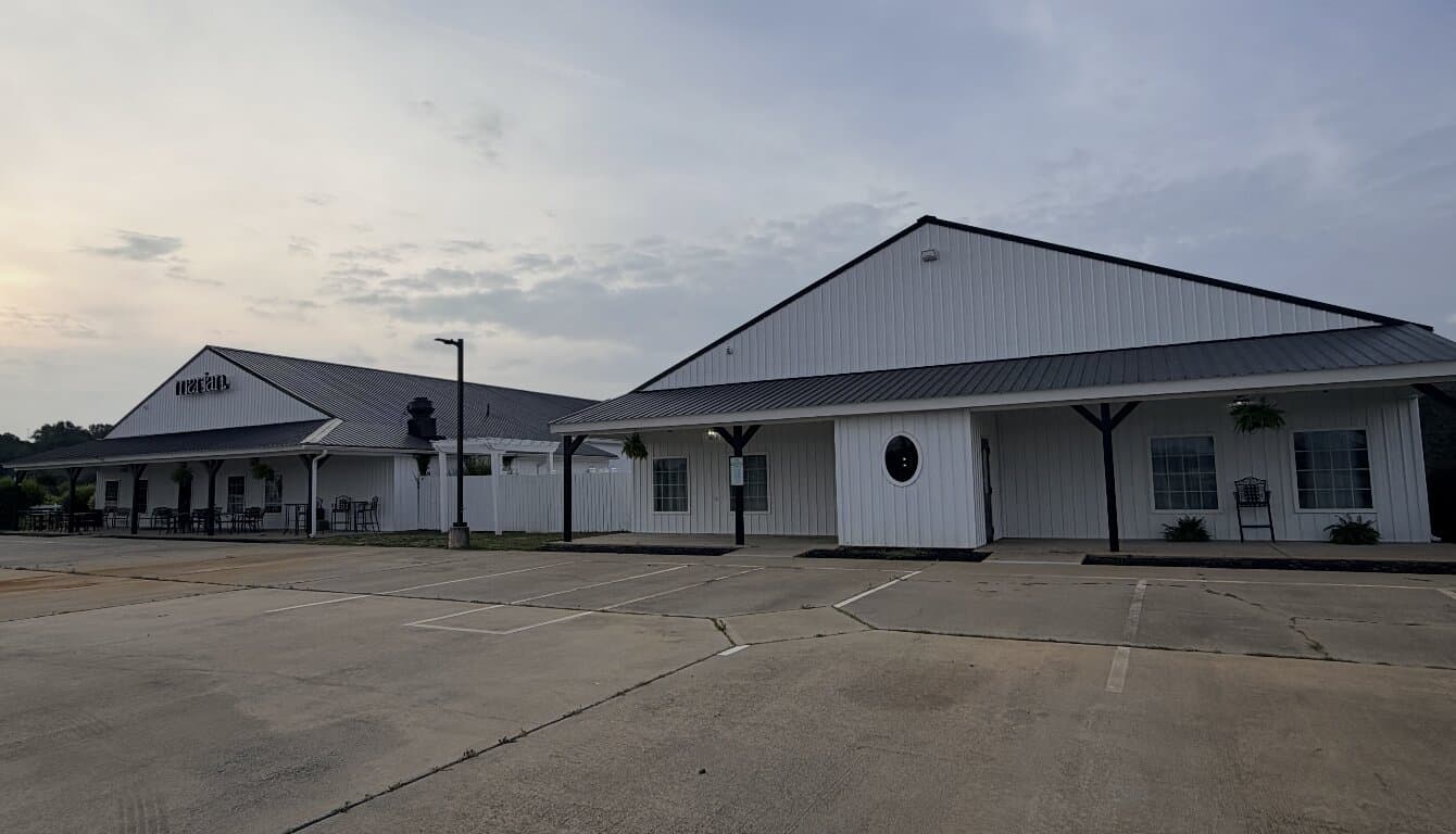 Exterior of the Havenwing Vineyards banquet hall with covered entrance and ample parking